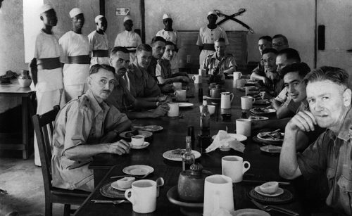 Colonial officers having breakfast