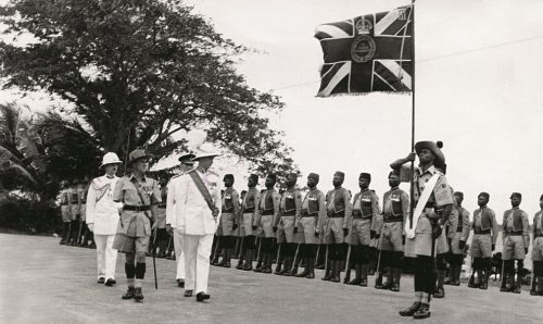 Colonial military officer inspecting soldiers of the West African Frontier Force during a ceremonial parade