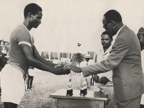 Shehu Musa Yar’Adua (first from left) receiving a trophy on behalf of his team during the Officers’ Sports Week